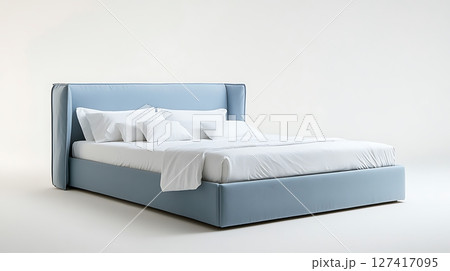 A large blue bed with white pillows and sheets A large blue bed with white pillows and sheets 127417095