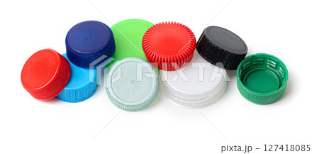 Colorful plastic bottle caps forming a pattern on white background 127418085