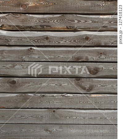 Weathered gray wooden planks showing wood grain creating rustic texture 127418123