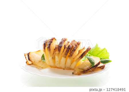 Hot dish of potatoes and lard in a mold 127418491