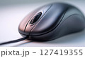 Ergonomic desk setup featuring a left-oriented computer mouse and minimal modern design elements 127419355