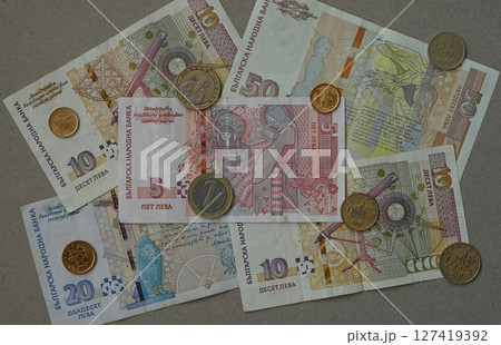 Bulgarian leva banknotes and coins arranged on neutral background. Bulgarian Levs. Bulgarian National Currency. Bulgarian National Bank 127419392