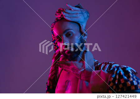 Neon light studio close-up portrait handsome black 127421449