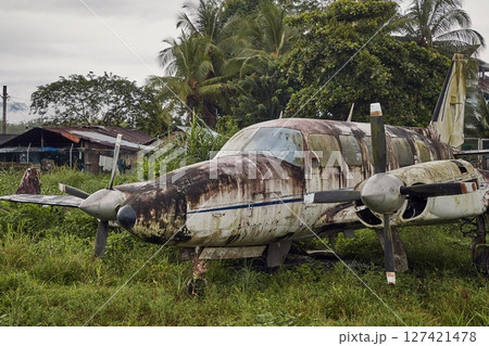 Small old plane abandoned in the jungle Small old plane abandoned in the jungle 127421478