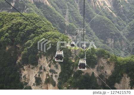 Cable car is used to travel from the bottom to the top of Yuntaishan Park is the most beautiful geological park in Henan Province, China. 127421570