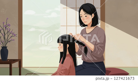 母親が娘の髪を優しく結んであげる愛おしい時間 127421673
