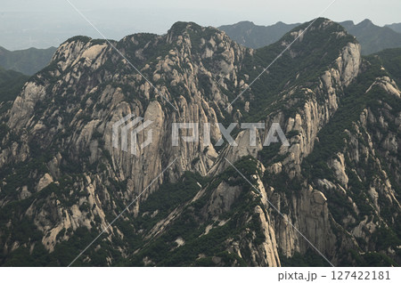Mount Huashan is one of the most famous tourist attractions in China and one of the must-do activities is rock climbing and hiking. It is a sacred mountain, home to many deities. 127422181