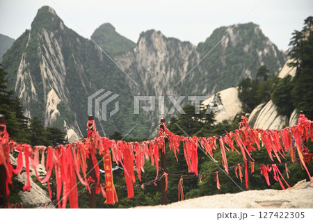 The walkway railings in the temple area have red Yantra tied to them at of Huashan Mountain is one of the most famous tourist attractions in China. The walkway railings in the temple area have red Yantra tied to them at of Huashan Mountain is one of the most famous tourist attractions in China. 127422305