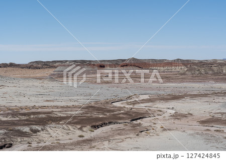 Eroded Desert Landscape at Petrified Forest National Park Under Clear Blue Sky Eroded Desert Landscape at Petrified Forest National Park Under Clear Blue Sky 127424845
