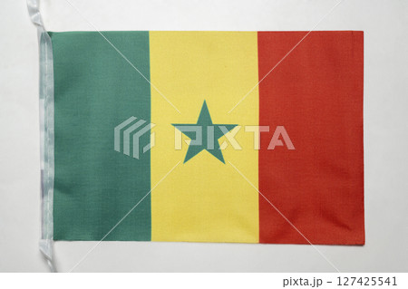 Closeup view of the Senegal national flag isolated over a white background. Concept of government and nationality 127425541