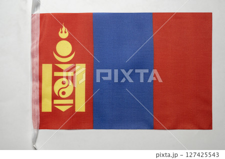 Closeup view of the Mongolia national flag isolated over a white background. Concept of government and nationality 127425543