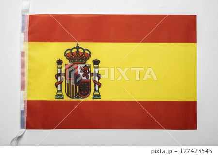 Closeup view of the Spain national flag isolated over a white background. Concept of government and nationality Closeup view of the Spain national flag isolated over a white background. Concept of government and nationality 127425545