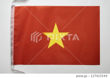 Closeup view of the Vietnam national flag isolated over a white background. Concept of government and nationality 127425549