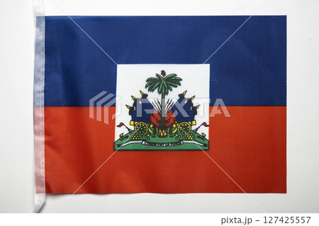 Closeup view of the Haiti national flag isolated over a white background. Concept of government and nationality 127425557