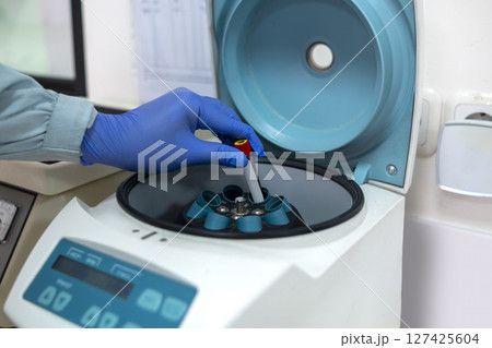 Scientist checking quality of medicine in the modern inspection laboratory in a medicine production factory Scientist checking quality of medicine in the modern inspection laboratory in a medicine production factory 127425604