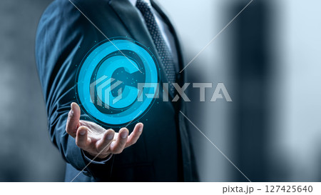 Businessman showing a copyright logo on his hand. Technology innovation on a virtual screen. Concept of digital copyright and patent, intellectual assets and property, legal protection Businessman showing a copyright logo on his hand. Technology innovation on a virtual screen. Concept of digital copyright and patent, intellectual assets and property, legal protection 127425640