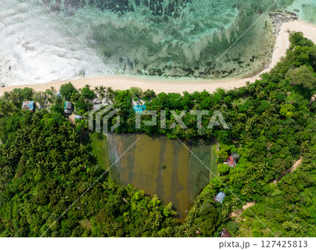 Shoreline with white sand and clear sea water with sunlight reflection. Santa Fe, Tablas, Romblon. Philippines. Shoreline with white sand and clear sea water with sunlight reflection. Santa Fe, Tablas, Romblon. Philippines. 127425813