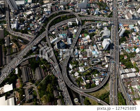Dense cityscape with elevated highways surrounded by residential and commercial buildings. Bangkok, Thailand. Dense cityscape with elevated highways surrounded by residential and commercial buildings. Bangkok, Thailand. 127425885