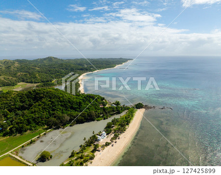 White sand beach with turquoise sea water and corals in Santa Fe, Tablas, Romblon. Philippines. 127425899