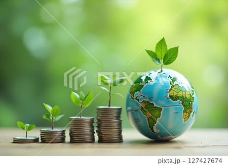 Growing plants on coins symbolize green energy and sustainable resources 127427674