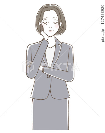 頬に手をあてて考えこむスーツの女性 127428920