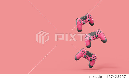 Realistic red video game joysticks or gamepads on pink background Realistic red video game joysticks or gamepads on pink background 127428967