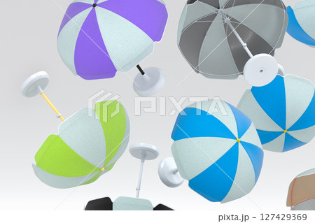 Many of flying striped beach umbrella for lounge zone on seashore on white 127429369