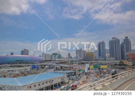 June 7 2025 Urban Highway with Cars and Modern Skyscrapers Under Blue Sky 127430150