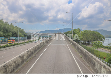 June 7 2025 Elevated Road With Curve and Scenic Urban and Natural Background 127430168