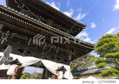 Kyoto, Japan - Jan 1,2023 : Seiryoji Temple with blue sky in Kyoto, Japan on Jan 1,2023. Kyoto, Japan - Jan 1,2023 : Seiryoji Temple with blue sky in Kyoto, Japan on Jan 1,2023. 127430980