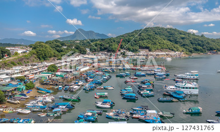 June 7 2025 Harbor View with Boats Docked and Mountainous Background Under Blue Sky 127431765