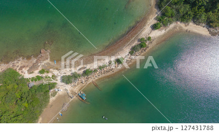View of a Scenic Peninsula with Greenery and Clear Blue Waters 127431788