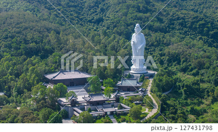 June 7 2025 Large Buddhist Statue Amidst Greenery and Temple Complex 127431798