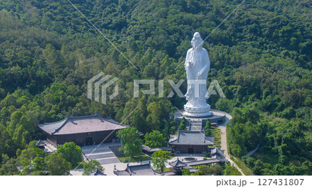June 7 2025 Large Buddhist Statue Amidst Greenery and Temple Complex 127431807