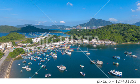 June 7 2025 Harbor View with Boats Docked and Mountainous Background Under Blue Sky June 7 2025 Harbor View with Boats Docked and Mountainous Background Under Blue Sky 127431853