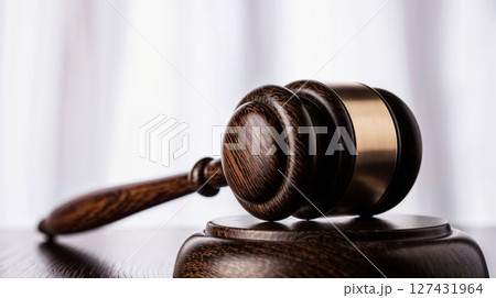 Wooden gavel close-up with white curtain background 127431964