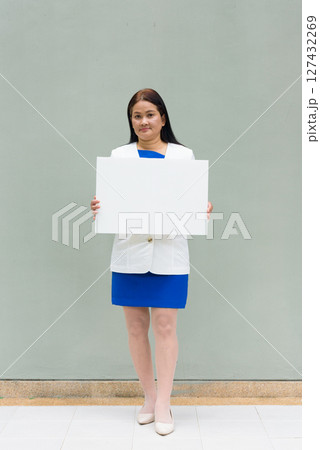 Woman holding empty board with copy space 127432269