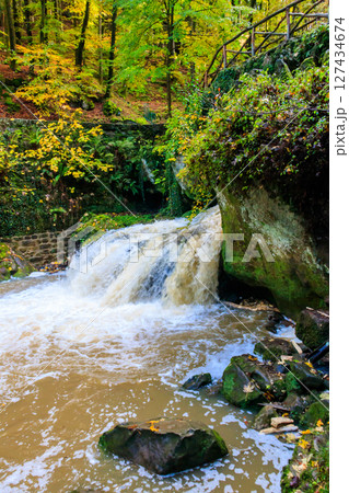 Schiessentumpel waterfall in the Mullerthal, Luxembourg in autumn Schiessentumpel waterfall in the Mullerthal, Luxembourg in autumn 127434674