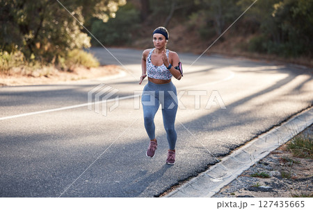 Wellness, nature or woman running on mountain street for marathon training, cardio fitness or workout. Motivation, sports or girl runner from Canada for road exercise, health or triathlon outdoor Wellness, nature or woman running on mountain street for marathon training, cardio fitness or workout. Motivation, sports or girl runner from Canada for road exercise, health or triathlon outdoor 127435665