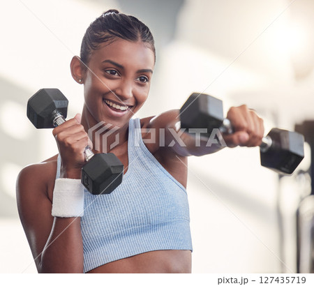 Woman, dumbbell or punching in gym workout, training or exercise in muscle growth, strong body or wellness target goal. Smile, happy or fitness athlete weightlifting heavy metal in Indian health club Woman, dumbbell or punching in gym workout, training or exercise in muscle growth, strong body or wellness target goal. Smile, happy or fitness athlete weightlifting heavy metal in Indian health club 127435719