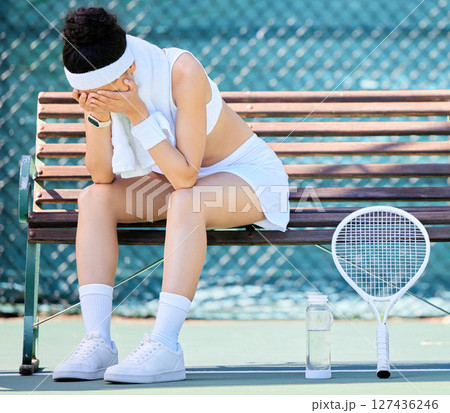 Tired, crying and tennis player with fail in a competition, depression from training stress and mistake in sports. Anxiety, fitness and athlete sad on a tennis court in fear of losing in a game 127436246