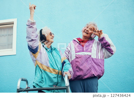 Senior, music and disability with a woman friends outdoor in a city having fun together with a peace sign hand gesture. Freedom, retirement and happy with a mature female and friend bonding outside 127436424