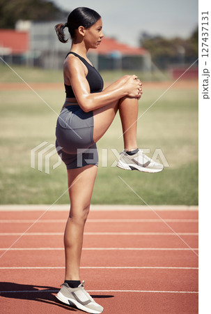 Stretching, fitness and running with woman on stadium track for sprinting, workout and training practice. Sports, cardio and endurance with runner and warm up for stamina, marathon and energy Stretching, fitness and running with woman on stadium track for sprinting, workout and training practice. Sports, cardio and endurance with runner and warm up for stamina, marathon and energy 127437131