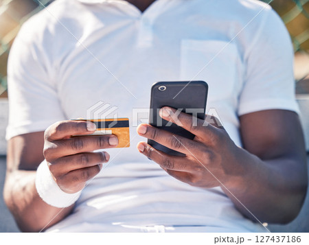 Black man, hands and phone with credit card for online banking, ecommerce or remote transaction. Hand of shopper using mobile smartphone and card for banking app, digital payment or wireless purchase 127437186