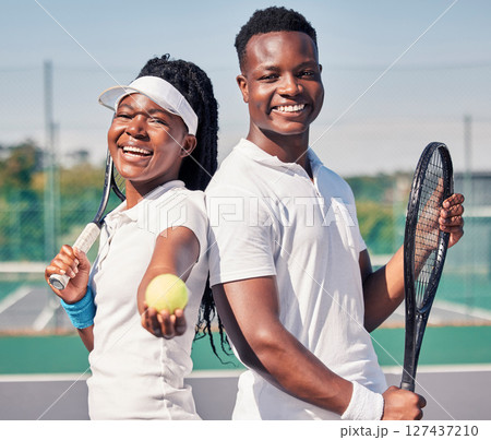 Tennis, fitness and portrait of couple with smile standing on court in summer for friendly match. Sports exercise, happy friendship and teamwork, healthy black woman and young man at fun doubles game Tennis, fitness and portrait of couple with smile standing on court in summer for friendly match. Sports exercise, happy friendship and teamwork, healthy black woman and young man at fun doubles game 127437210