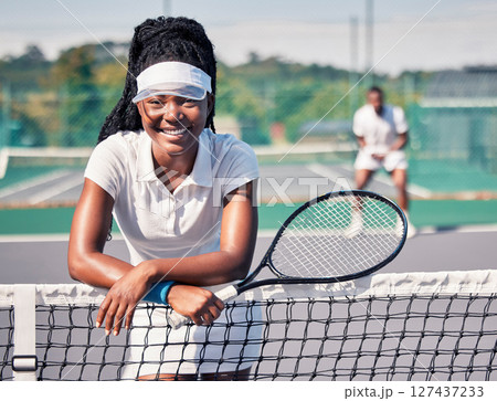 Sports, black woman and relax on tennis court outdoor for fitness, wellness exercise or workout portrait. Athlete person, training mindset and healthy tennis player smile on court net for break 127437233