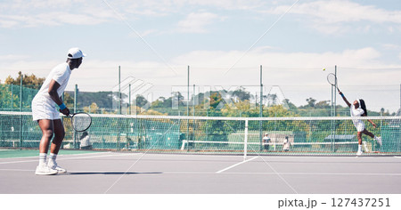 Fitness, tennis and people on tennis court, athlete playing game with focus and sport workout outdoor. Sports match, young man, woman and cardio while training and exercise together with teamwork Fitness, tennis and people on tennis court, athlete playing game with focus and sport workout outdoor. Sports match, young man, woman and cardio while training and exercise together with teamwork 127437251