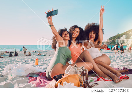 Phone, selfie and women friends on the beach with freedom on a summer adventure on vacation in Mexico. Travel, happiness and girls taking a picture on seaside holiday or journey by the ocean together Phone, selfie and women friends on the beach with freedom on a summer adventure on vacation in Mexico. Travel, happiness and girls taking a picture on seaside holiday or journey by the ocean together 127437368