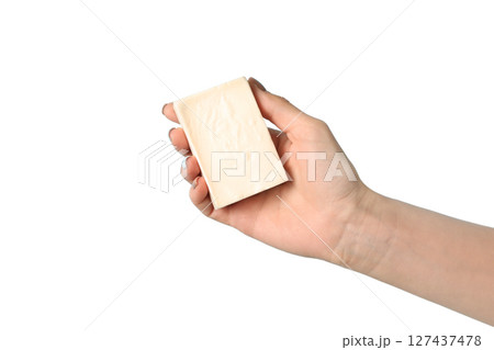 Hand presenting a bar of soap on white background, isolated on white 127437478