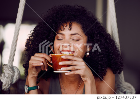 Happy black woman, drinking coffee and relax in cafe, restaurant and peace, freedom and easy lifestyle. Female happy customer enjoying cup of tea, cappuccino and warm beverage in coffee shop alone 127437537